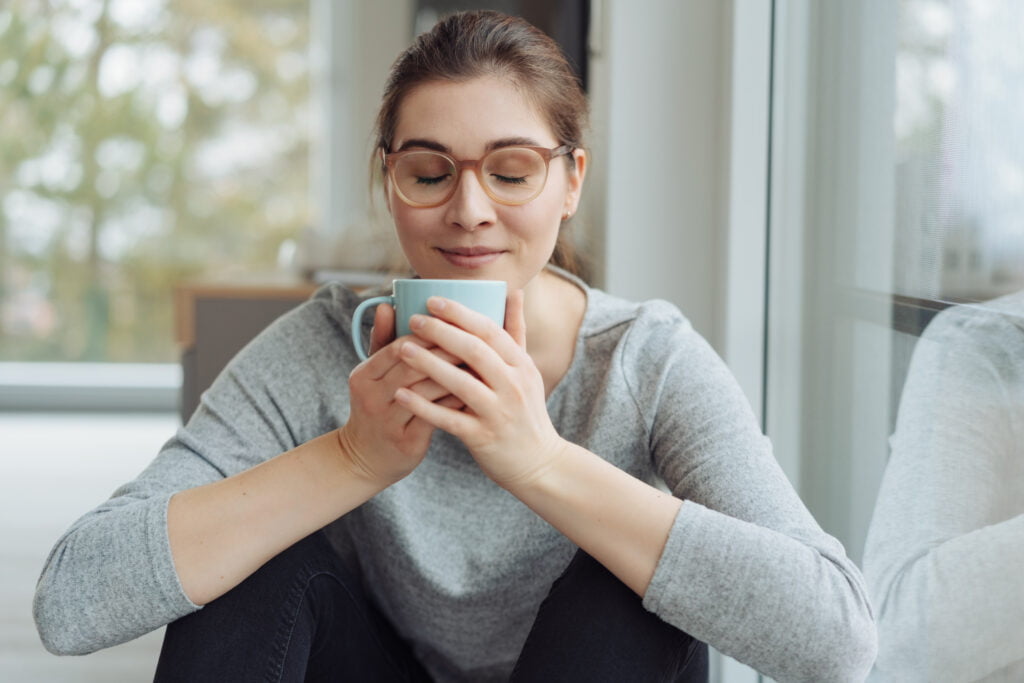 Gratitude is slowing down to savor and enjoy a cup of coffee like the woman pictured here.