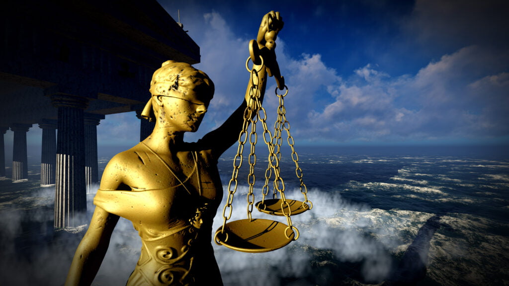 Image of classical statue depicting blind justice with scales. True Justice is Moral, it treats everyone's interests equally